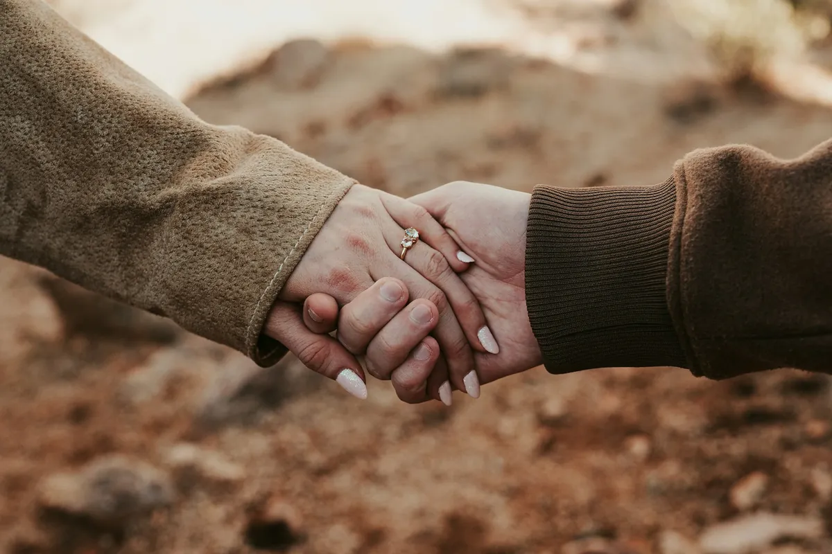 Close-up of a couple holding hands