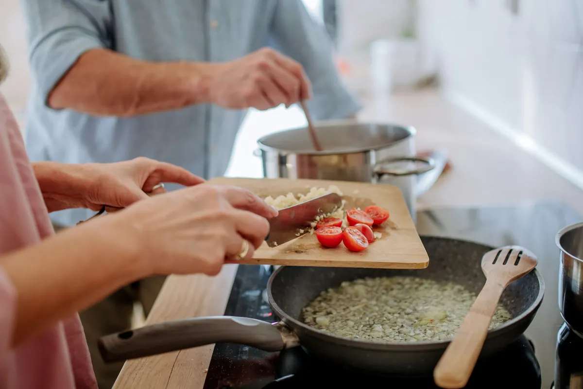 Couple cooking together in the kitchen