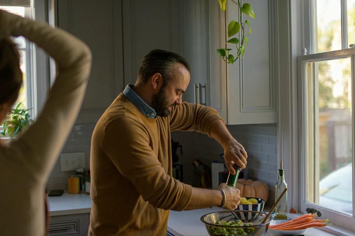 Couple cooking together in the kitchen