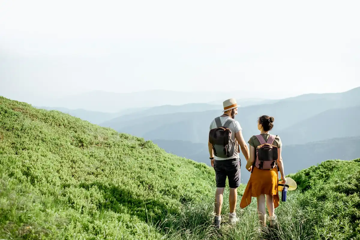 Couple hiking together in the hills