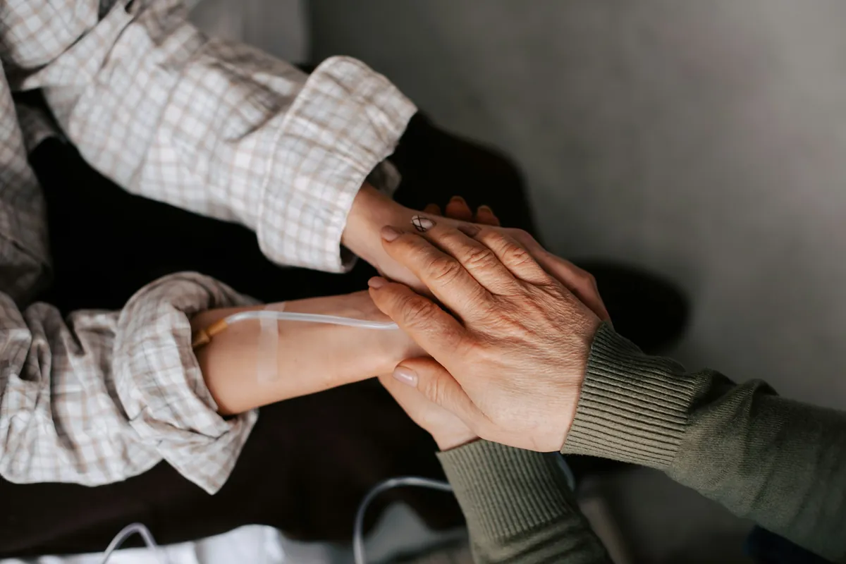 Couple holding hands across a table
