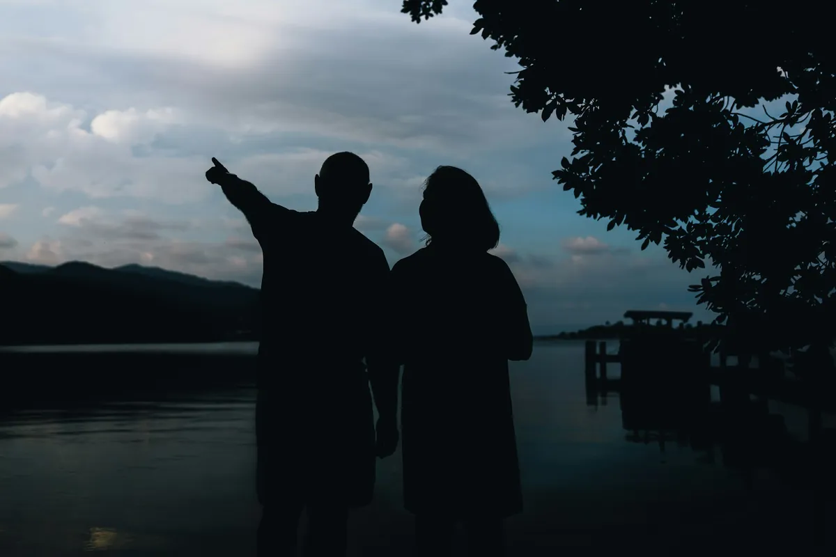 Couple looking out at the sea together