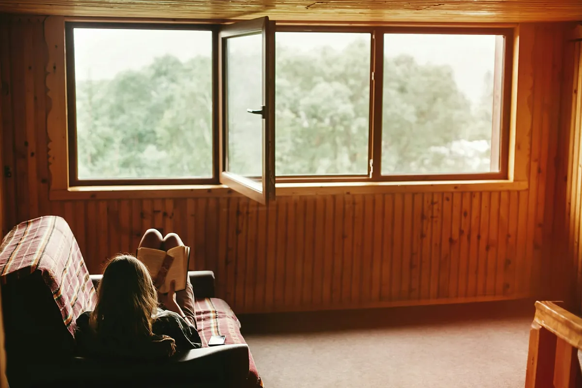 Couple relaxing at a cabin in nature