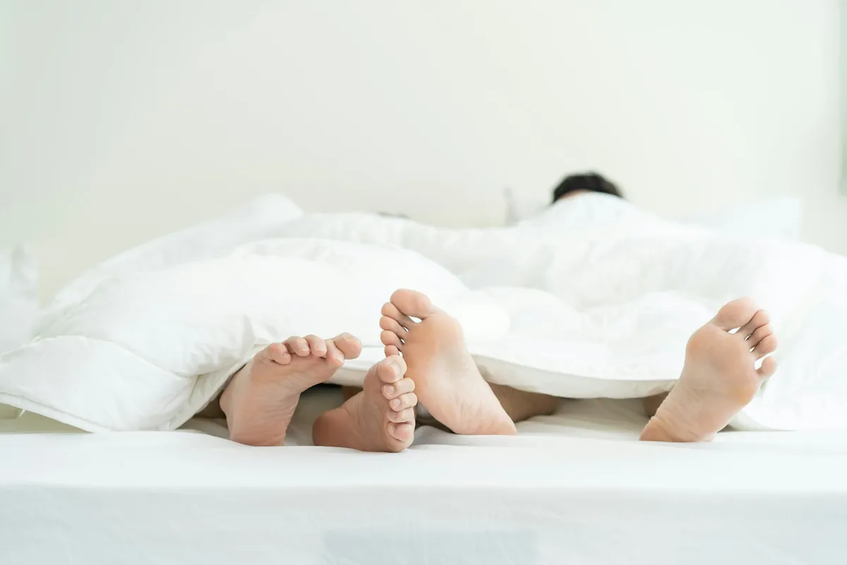 Couple resting in bed together
