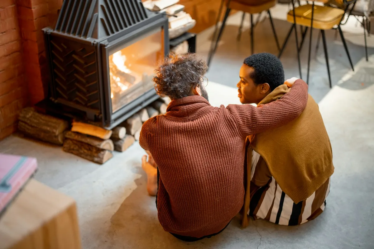 Couple sitting by the fire together