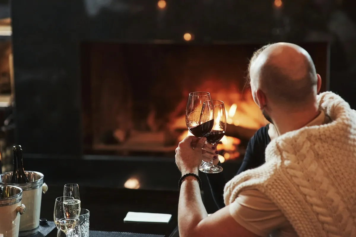 Couple sitting by the fire together
