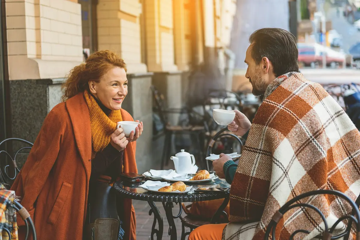 Couple talking over coffee