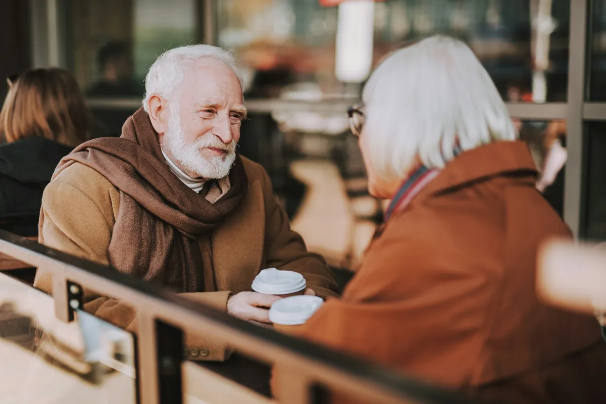 Couple talking over coffee