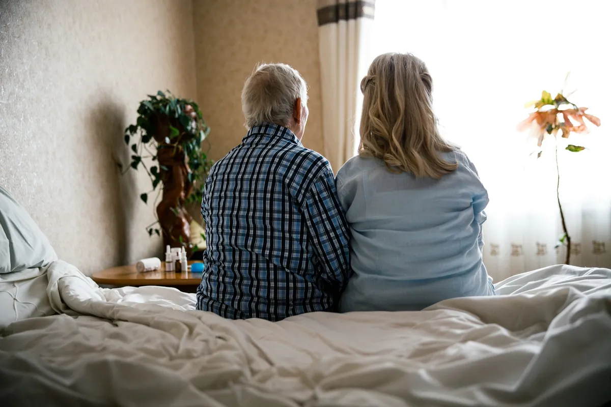 Couple together in bed