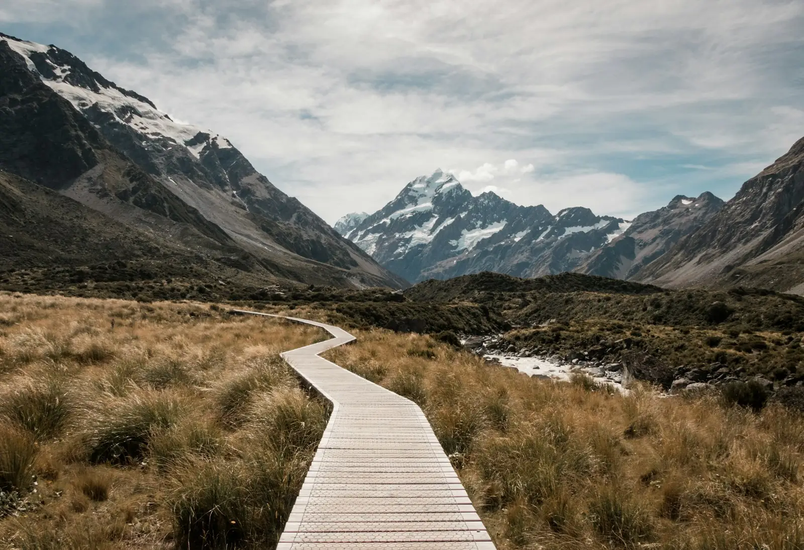 Boardwalk leading towards the mountains in New Zealand