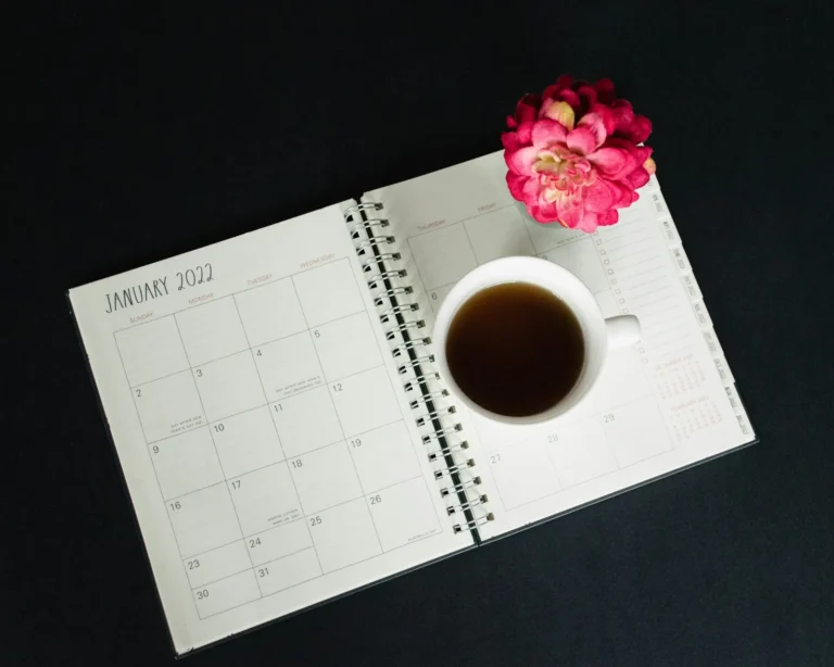 Calendar and a cup of coffee on a desk