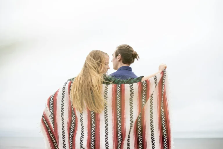 Couple wrapped in a blanket together