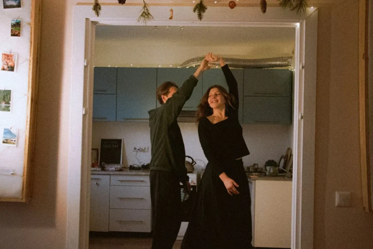 Couple dancing in the kitchen doorway
