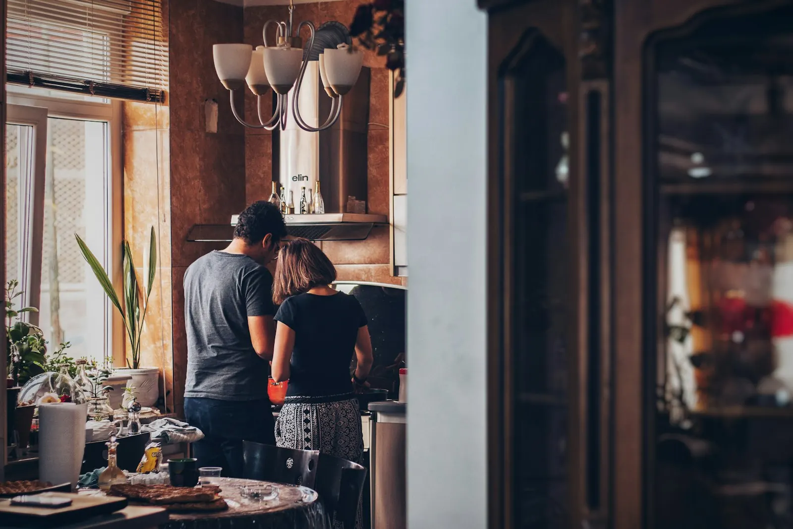 Couple standing tense in the kitchen