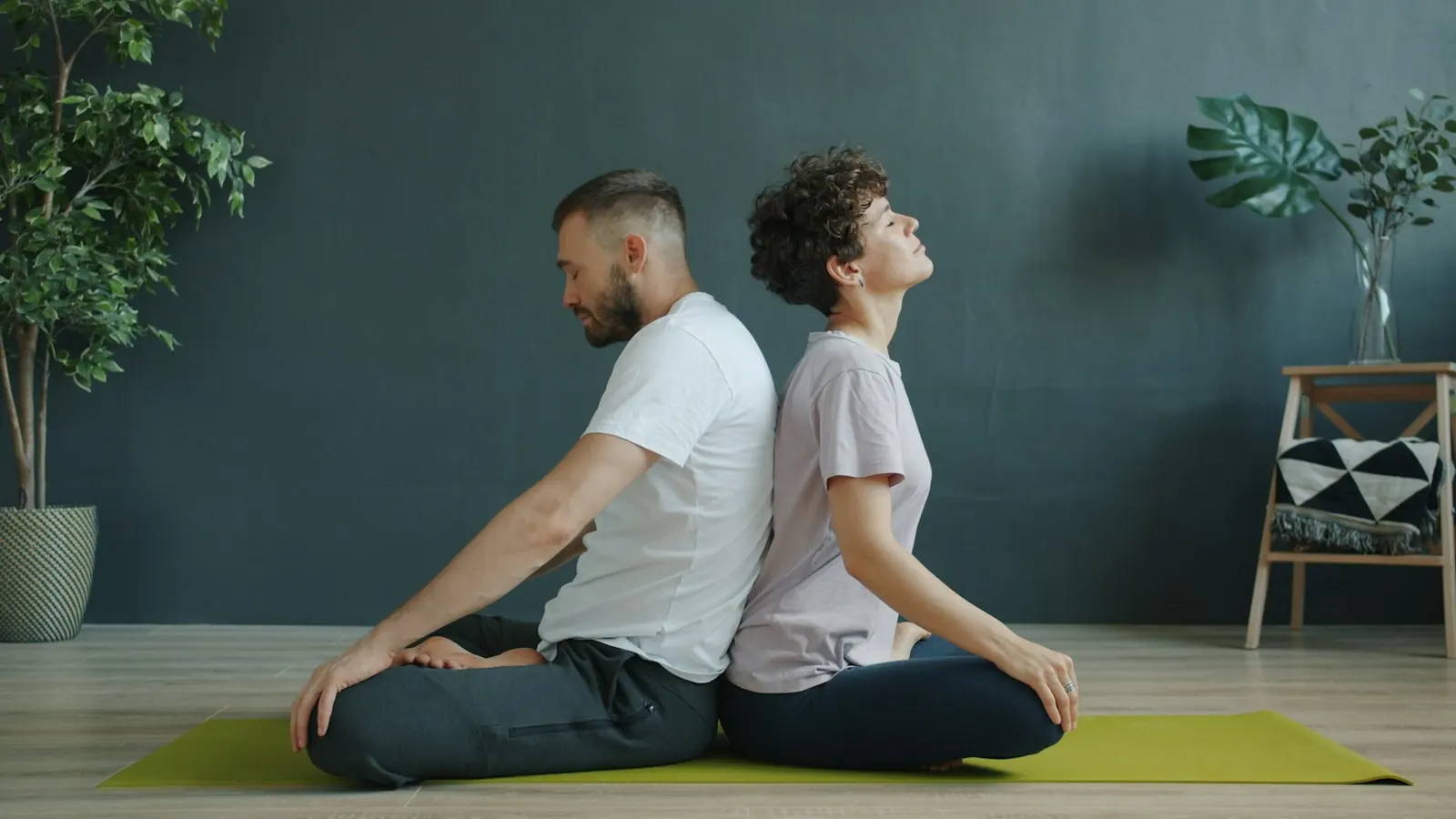 Couple meditating back to back